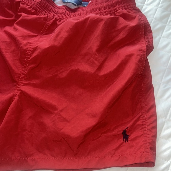 Gently use men’s polo size. Small shorts. - Picture 3 of 6